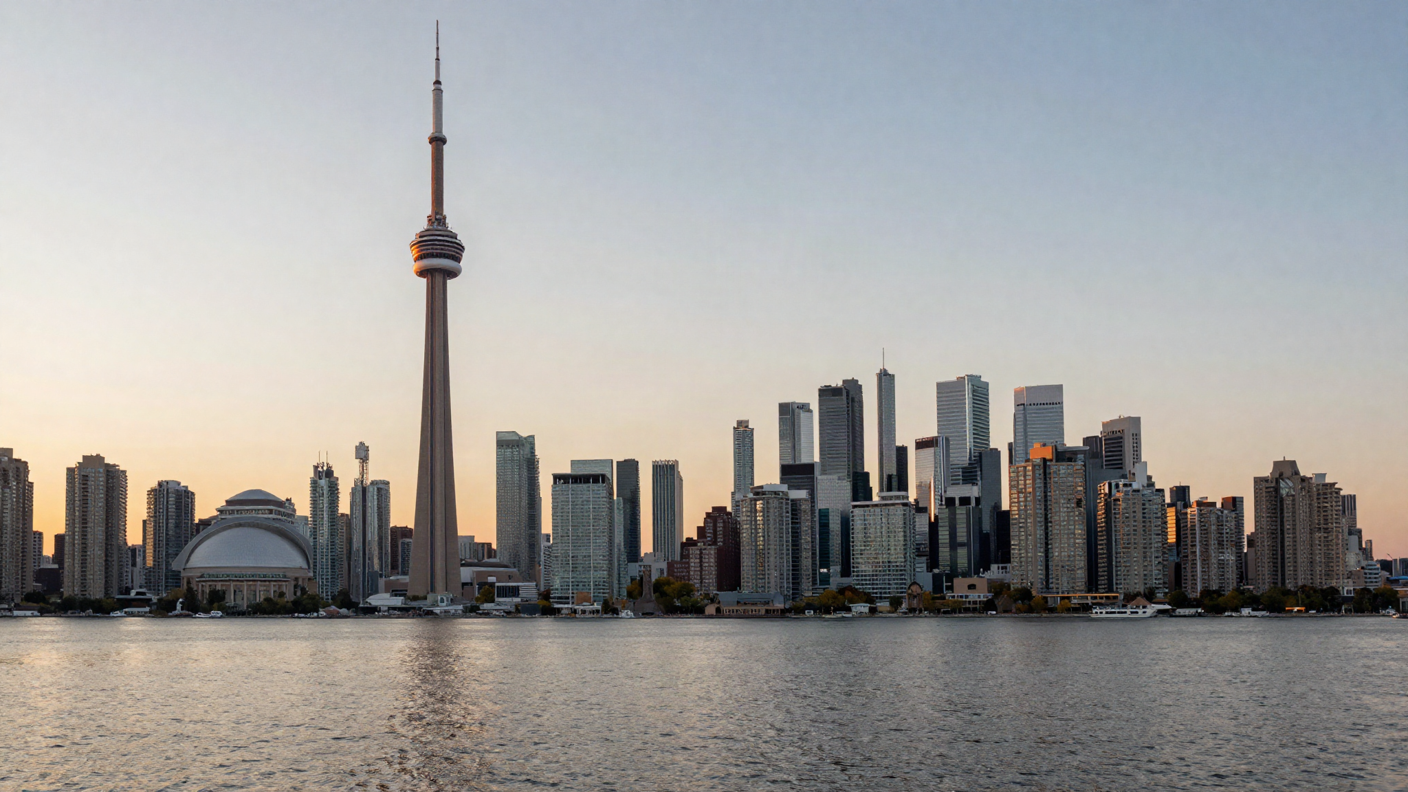 Toronto skyline at dusk with CN Tower representing the Ontario PNP program for UK applicants